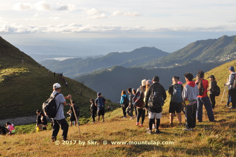 Hikers at the highest point of Ambanaw Paoay 1st. Peak, are having a 180-degree view of the Cordillera mountain ranges 