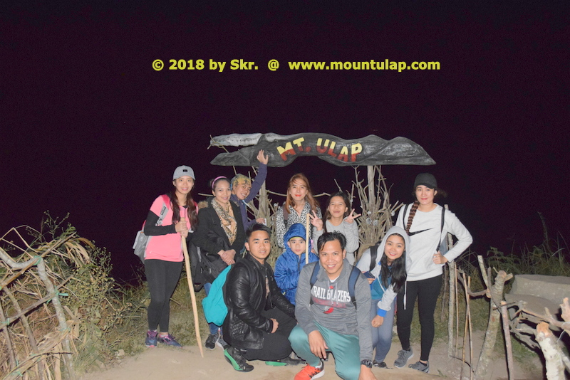 Eco-Tourism - Mt. Ulap, A group of night hikers posing beside the 1st. Tourist spot marker for a Photo remembrance.
