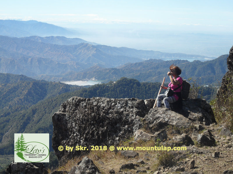 A panoramic view of the Cordillera mountain ranges hikers will have on the mountain rock Schauinsland hiking on Mount Ulap Eco-Trail.  